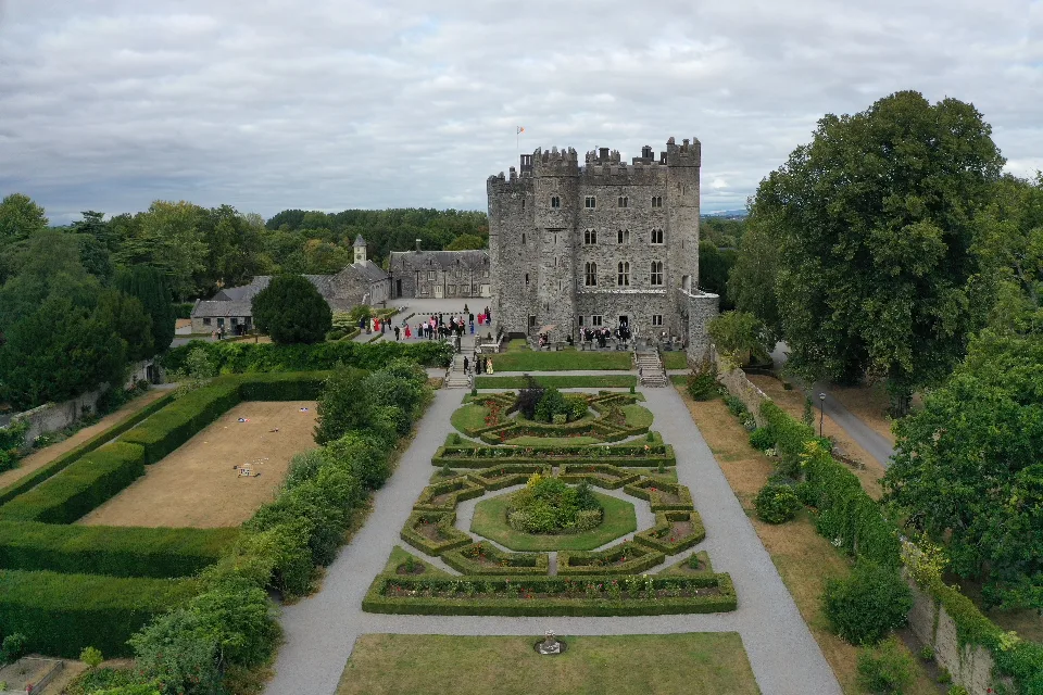 Kilkea Castle from the air, with the formal parterre garden and clipped hedging leading up to the castle