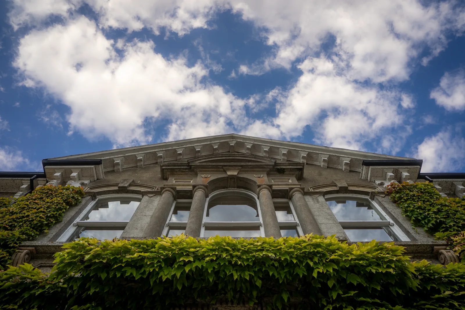Looking up at the ivy-covered pediment and sash windows on the original 17th century Lyrath House
